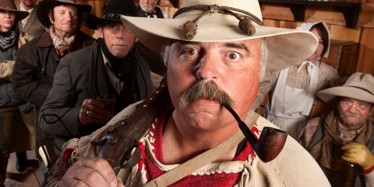 Cowboys in a bar staring at camera